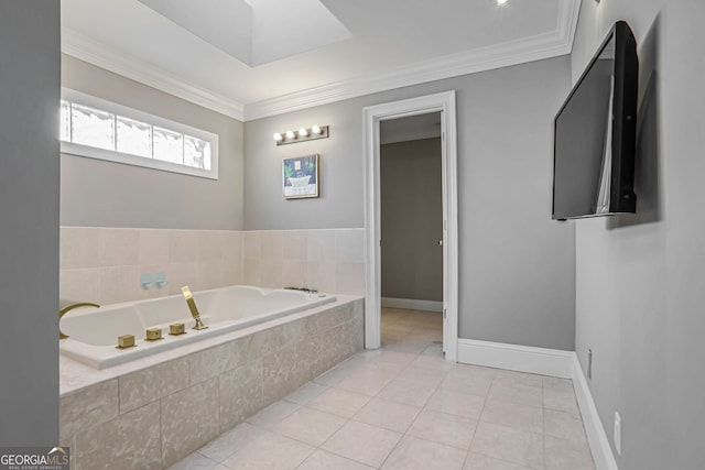 bathroom featuring a bath, tile patterned flooring, baseboards, and crown molding