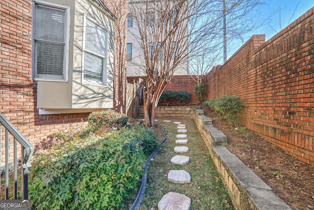 view of yard with a fenced backyard