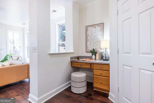 interior space with ornamental molding, visible vents, baseboards, and wood finished floors