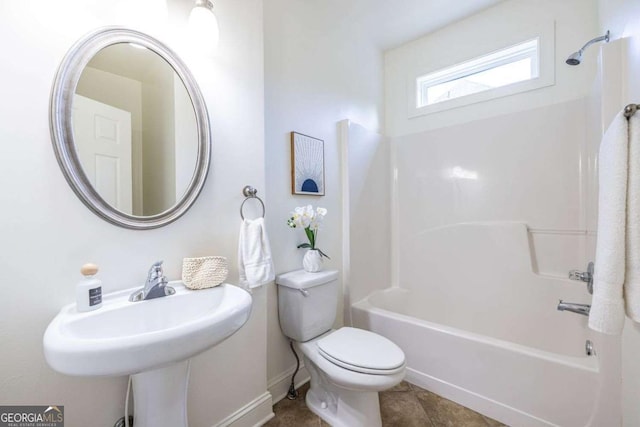 full bath with shower / bathing tub combination, toilet, and tile patterned floors