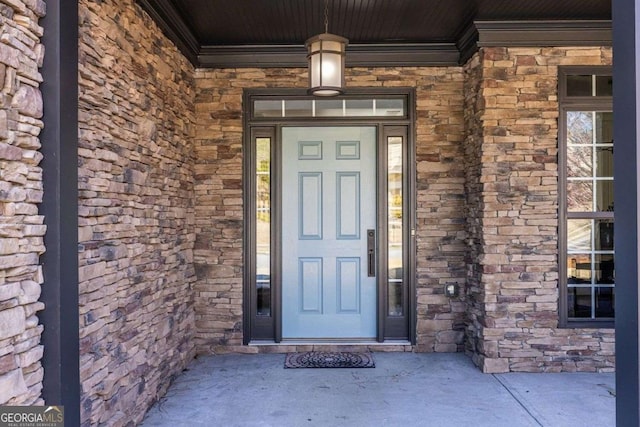 view of exterior entry with stone siding