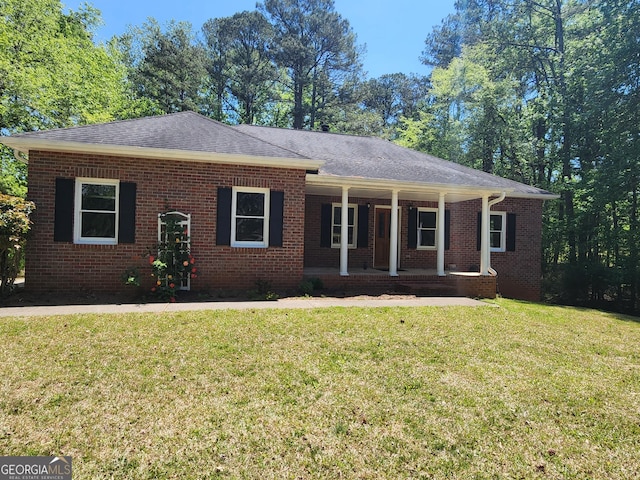 770 Prickett Rd, Douglasville, GA 30134 - ranch-style house with a front lawn, brick siding, a shingled roof, and covered porch