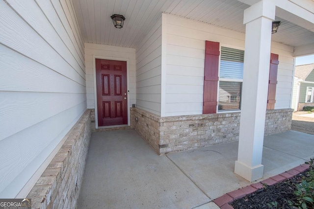 doorway to property with stone siding