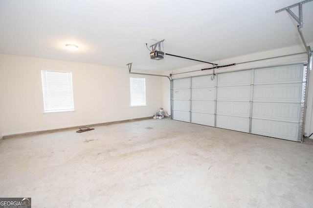 garage featuring baseboards and a garage door opener