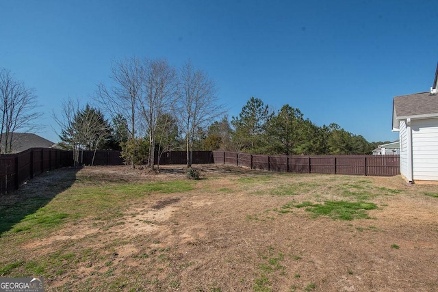 view of yard featuring a fenced backyard