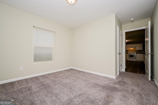 interior space with baseboards and carpet flooring