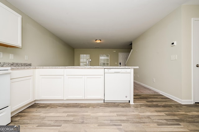 kitchen with light wood-style floors, light countertops, white cabinetry, and white dishwasher