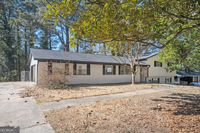 split level home with brick siding