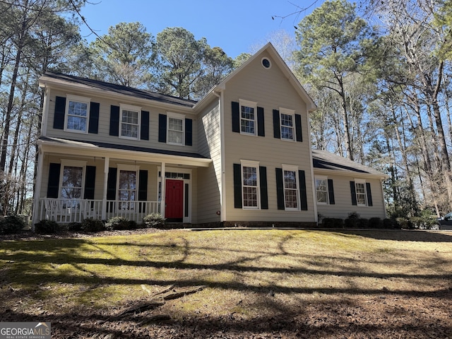 view of front of house featuring a porch and a front yard