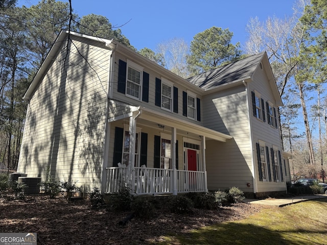 view of front of home featuring a porch and central AC