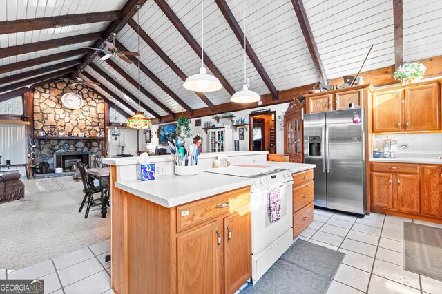 82 Swan Ave, Newnan, GA 30263 - kitchen featuring stainless steel fridge with ice dispenser, white electric range, light countertops, light tile patterned floors, and open floor plan