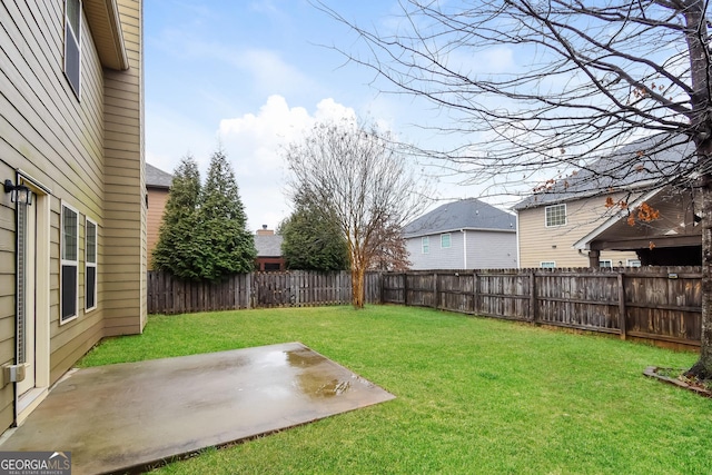 view of yard featuring a patio and a fenced backyard