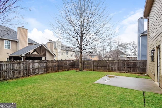 view of yard featuring a fenced backyard and a patio