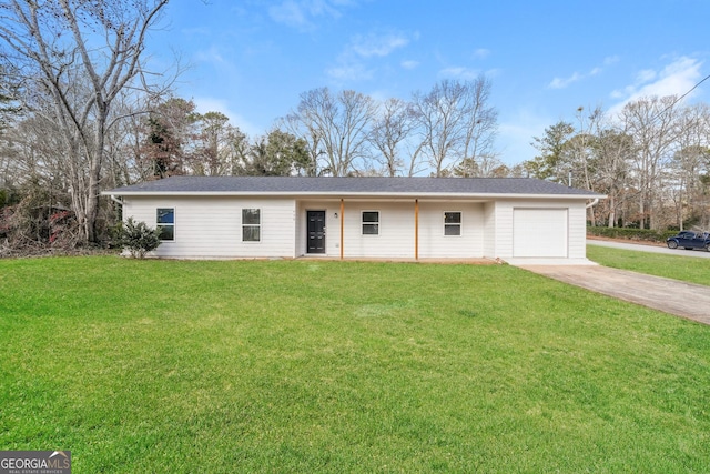 ranch-style home featuring driveway, a garage, and a front lawn