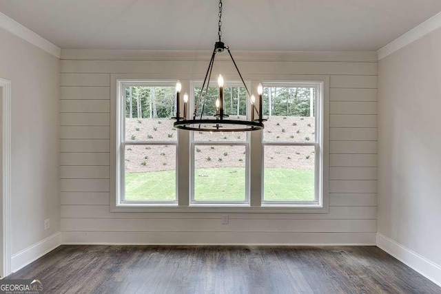 unfurnished dining area featuring dark wood-style floors and a healthy amount of sunlight