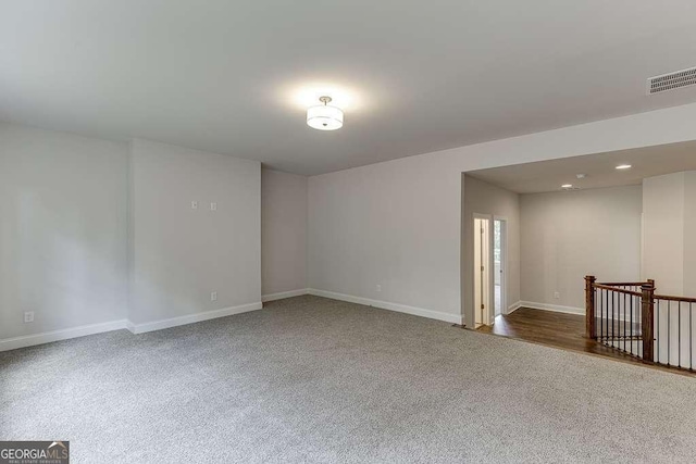 spare room with recessed lighting, visible vents, and baseboards