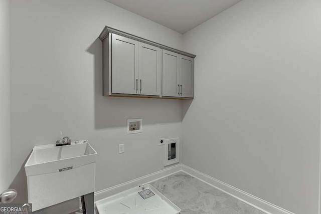 laundry area featuring hookup for a washing machine, hookup for an electric dryer, baseboards, marble finish floor, and cabinet space