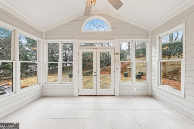 unfurnished sunroom featuring lofted ceiling and ceiling fan