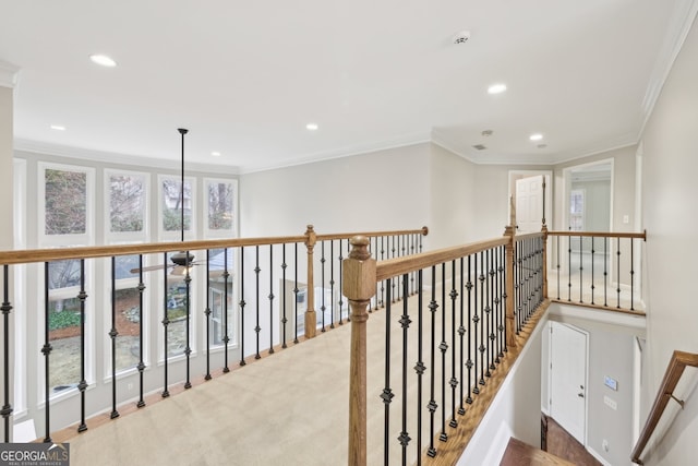 hall with recessed lighting and crown molding