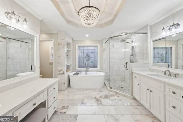 bathroom featuring vanity, a soaking tub, a stall shower, and ornamental molding