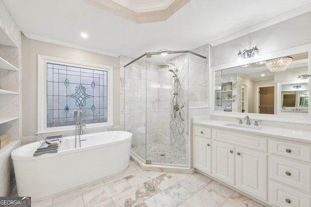 bathroom featuring vanity, a freestanding bath, a shower stall, crown molding, and marble finish floor