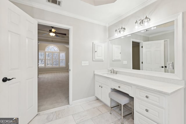 bathroom with visible vents, ornamental molding, baseboards, ceiling fan, and vanity