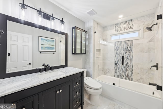 bathroom with visible vents, toilet, vanity, and  shower combination