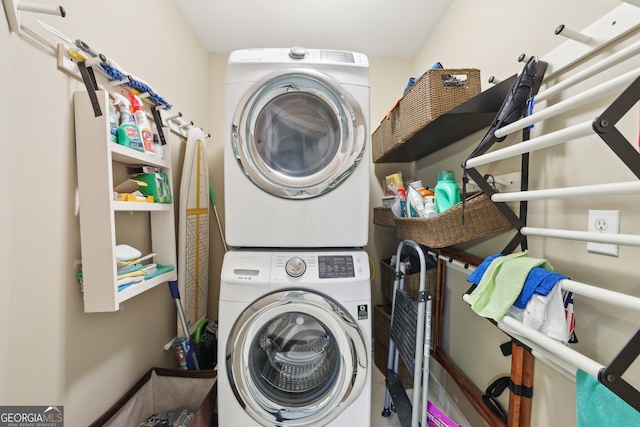 laundry area with laundry area and stacked washer and clothes dryer