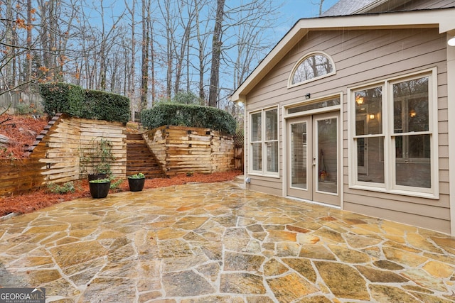 view of patio / terrace featuring french doors and fence