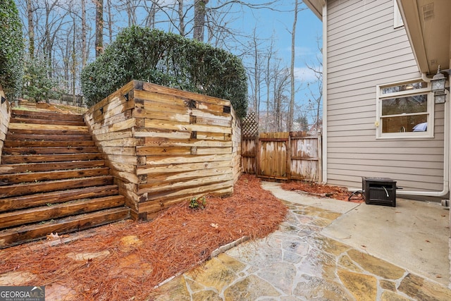 exterior space featuring a patio area and fence