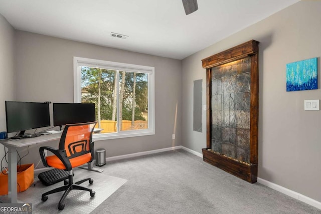 home office featuring light carpet, baseboards, and visible vents