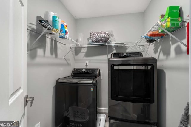 laundry room with laundry area and washer and clothes dryer