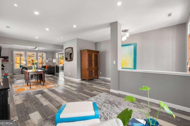 interior space with recessed lighting, visible vents, baseboards, and wood finished floors