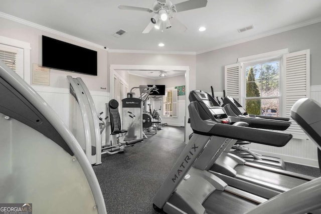 workout area with ornamental molding, visible vents, and a ceiling fan