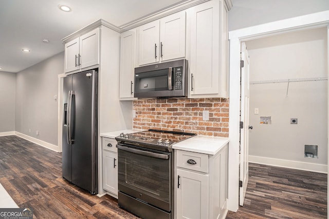 kitchen featuring stainless steel appliances, baseboards, white cabinets, light countertops, and dark wood-style floors