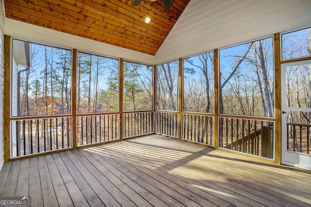 unfurnished sunroom featuring wooden ceiling and vaulted ceiling