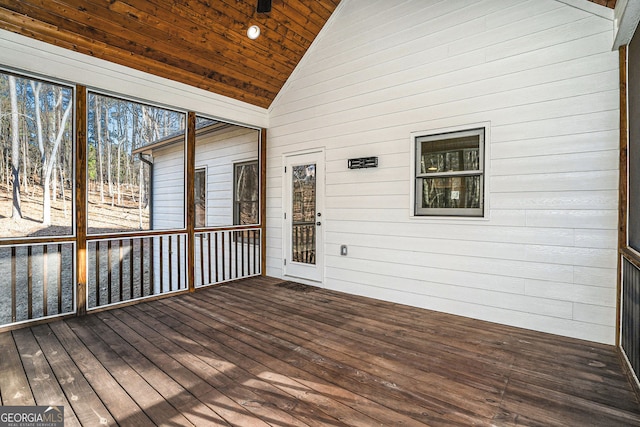 unfurnished sunroom with wooden ceiling and vaulted ceiling