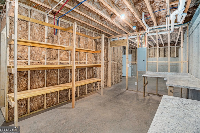 unfinished basement featuring electric panel