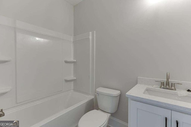 bathroom with toilet, washtub / shower combination, and vanity