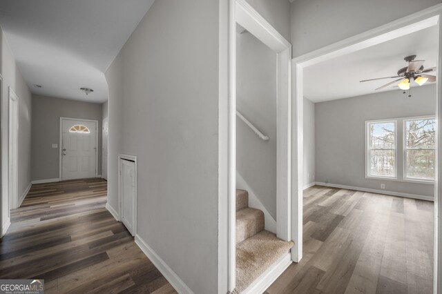 2820 Maxwell Pl, Lithia Springs, GA 30122 - hallway with stairway, wood finished floors, and baseboards