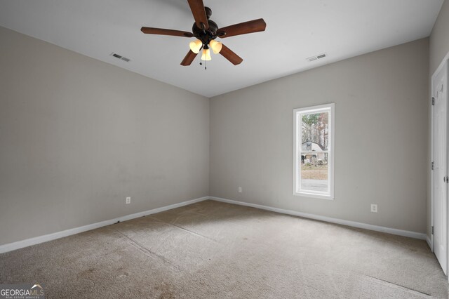 2820 Maxwell Pl, Lithia Springs, GA 30122 - carpeted empty room with visible vents, baseboards, and ceiling fan