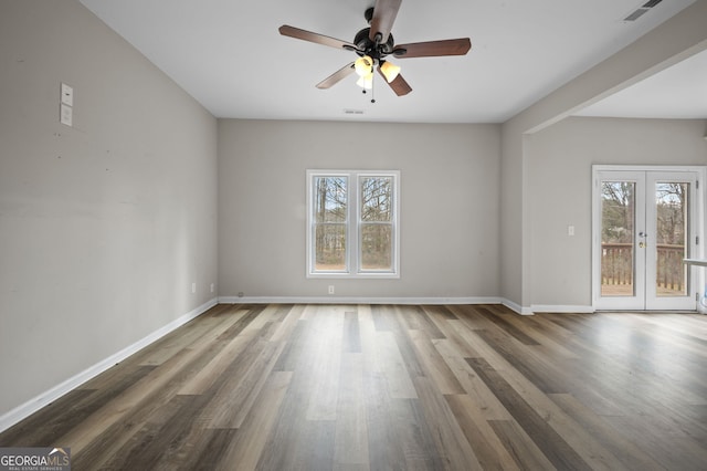 2820 Maxwell Pl, Lithia Springs, GA 30122 - spare room with a wealth of natural light, visible vents, a ceiling fan, and wood finished floors