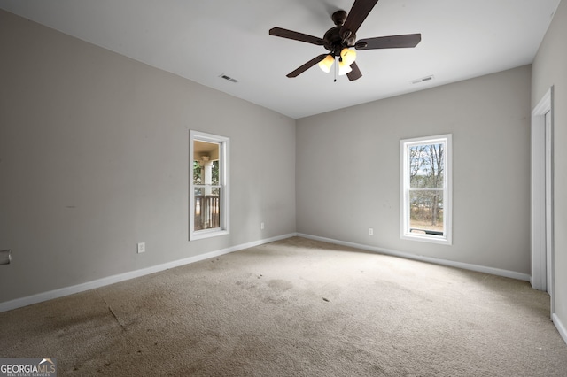 2820 Maxwell Pl, Lithia Springs, GA 30122 - empty room with visible vents, carpet floors, baseboards, and a ceiling fan