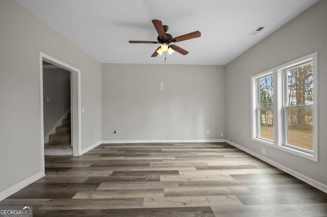 2820 Maxwell Pl, Lithia Springs, GA 30122 - unfurnished room featuring visible vents, baseboards, ceiling fan, and stairway