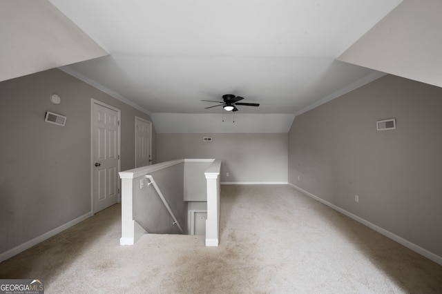 2820 Maxwell Pl, Lithia Springs, GA 30122 - additional living space featuring baseboards, visible vents, carpet floors, lofted ceiling, and ceiling fan