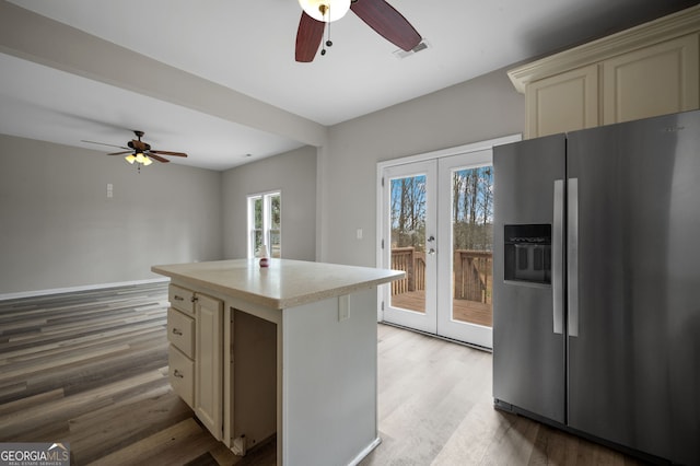 2820 Maxwell Pl, Lithia Springs, GA 30122 - kitchen with a ceiling fan, light countertops, stainless steel refrigerator with ice dispenser, and cream cabinets