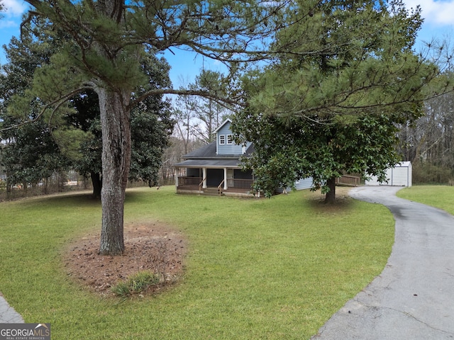 2820 Maxwell Pl, Lithia Springs, GA 30122 - view of front of house with a garage, a porch, and a front yard
