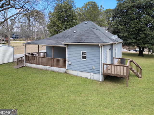 2820 Maxwell Pl, Lithia Springs, GA 30122 - rear view of property featuring a lawn, roof with shingles, and a deck