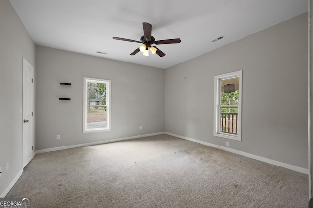 2820 Maxwell Pl, Lithia Springs, GA 30122 - unfurnished room with carpet flooring, baseboards, visible vents, and ceiling fan