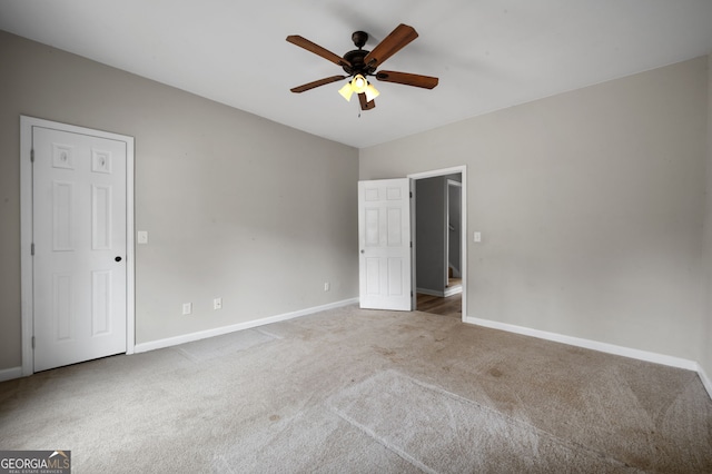 2820 Maxwell Pl, Lithia Springs, GA 30122 - unfurnished bedroom featuring carpet, baseboards, and ceiling fan